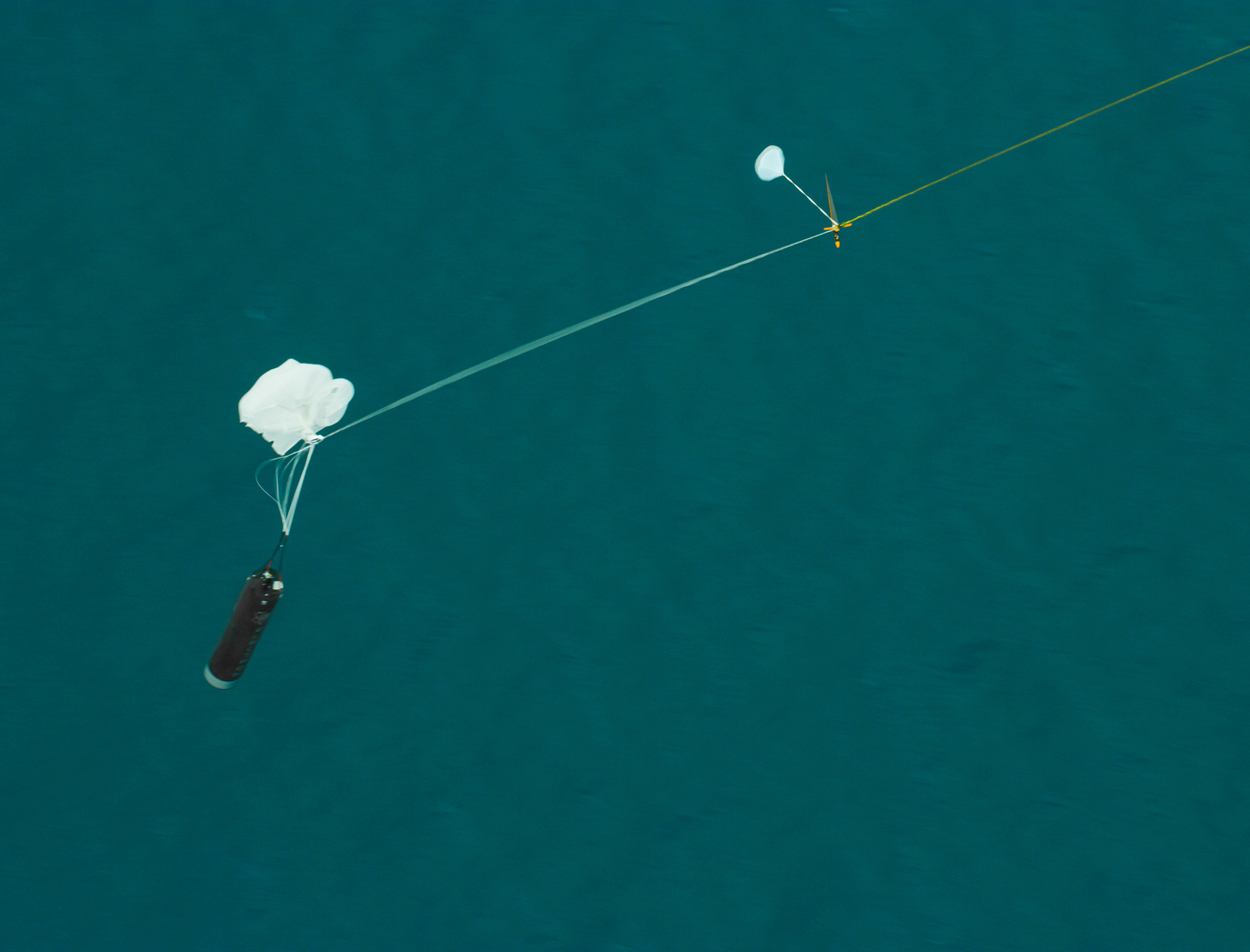 Helicopter catches and drops falling rocket mid-air in reusability test