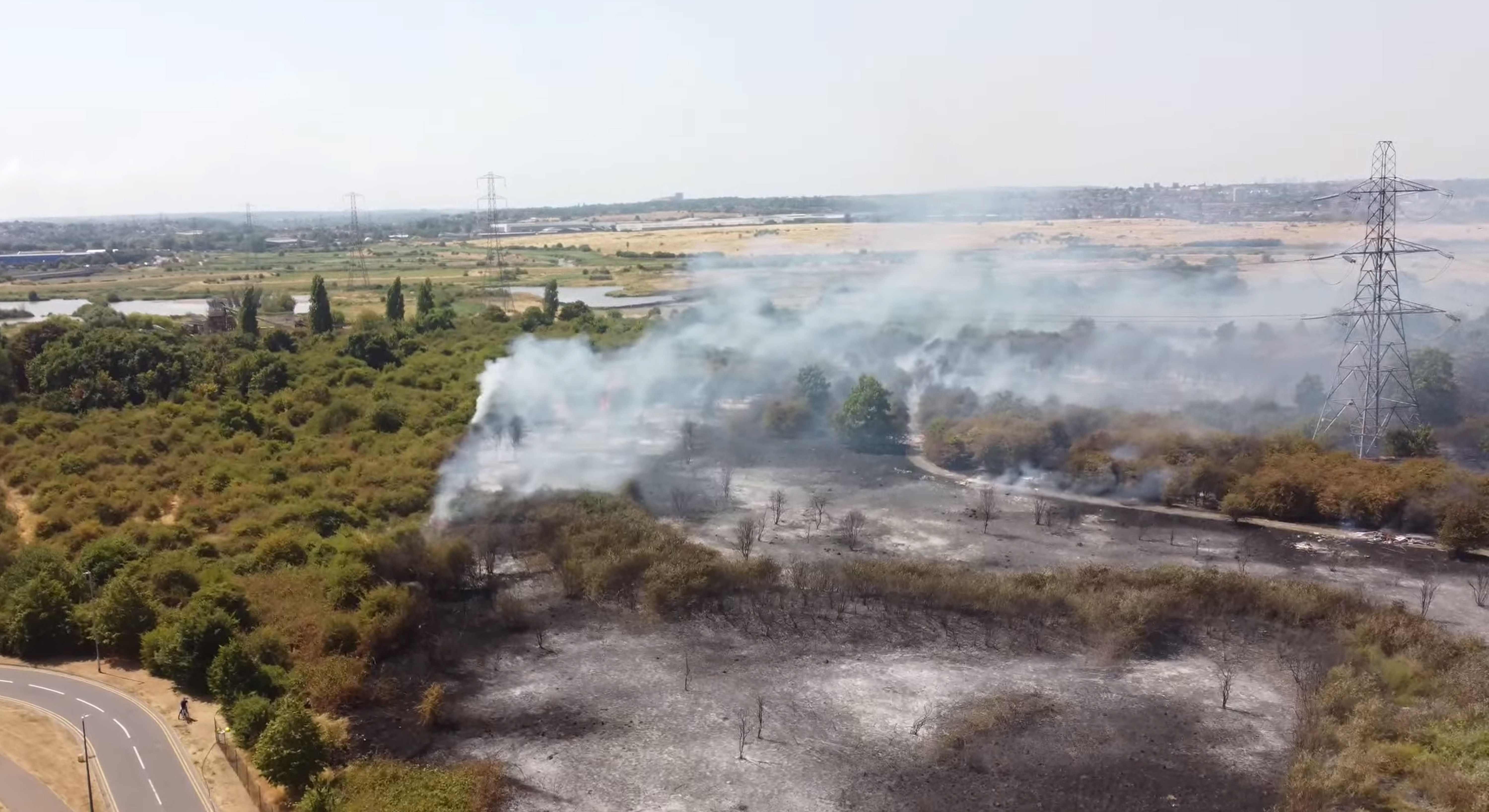 UK heatwave leaves behind trail of fire amid calls for climate change action