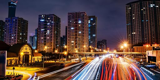 light trails from cars in a city nightscape