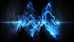Abstract of blue sound-light waves against a black backgroud