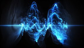 Abstract of blue sound-light waves against a black backgroud