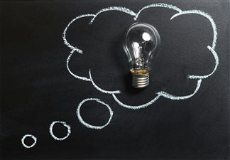 Blackboard with light bulb and thinking cloud