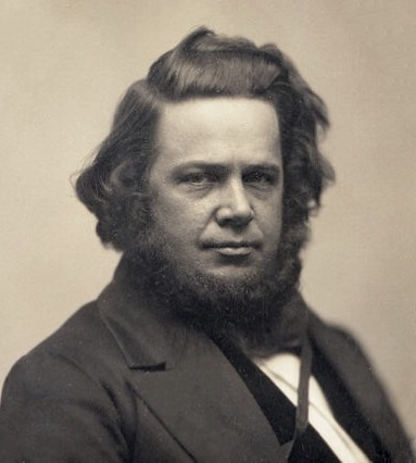 Old photograph of a man with long hair and a beard