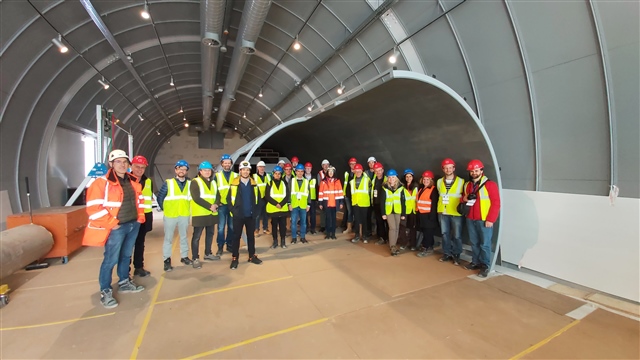  A group of people in hard hats in a tunnel
