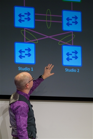 Ross Livings points at a network diagram