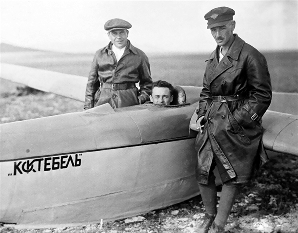 A man sits inside a glider