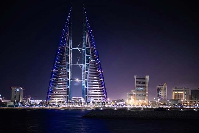 Two towers lit up at night