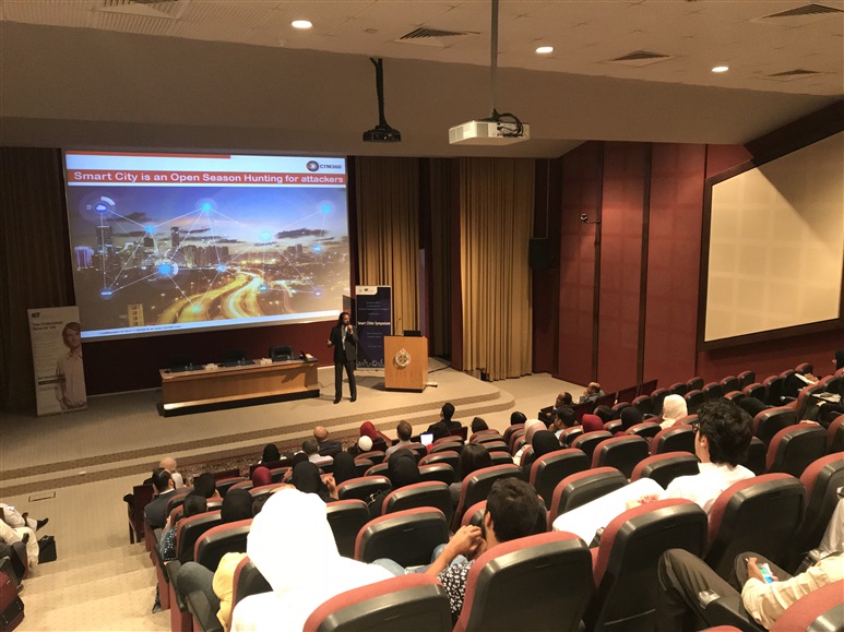  A speaker in a lecture theatre with a large audience